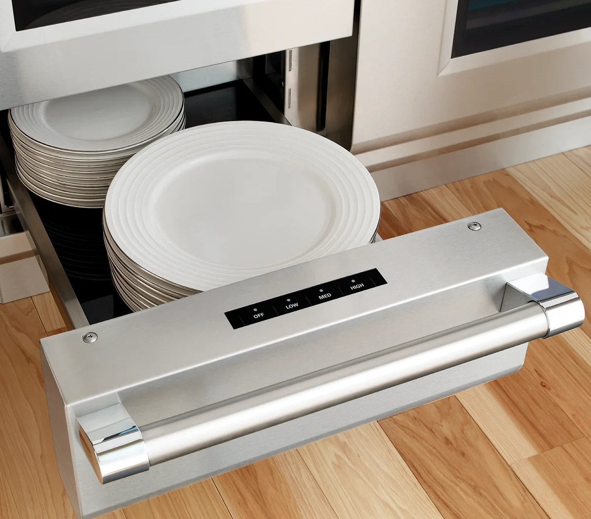 Modern kitchen drawer warmer with stacked plates, representing organized and innovative solutions, similar to how E-Learning Design Services streamline digital learning experiences.